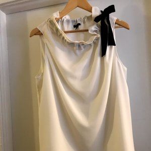 Cream blouse with black bow detail